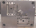 120px-Injection_molding_die_B_side